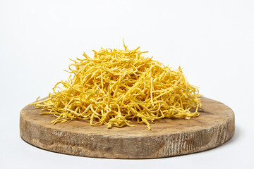 Egg noodles on a white background. Dry homemade noodles on a wooden board. Traditional pasta