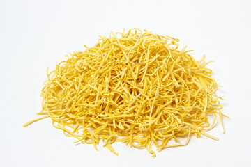 Egg noodles on a white background. Isolated dry homemade noodles. Traditional pasta