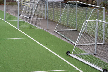Partial image of green artificial turf in sports stadium