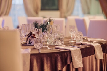 Restaurant table set up. Empty crystal glasses on house dinner table. Restaurant, banquet setting with crystal glasses