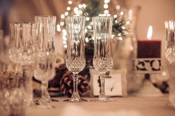Restaurant table set up. Empty crystal glasses on house dinner table. Restaurant, banquet setting with crystal glasses