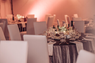 Restaurant table set up. Empty crystal glasses on house dinner table. Restaurant, banquet setting with crystal glasses