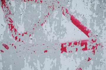 White cracked wall with red graffiti, no person