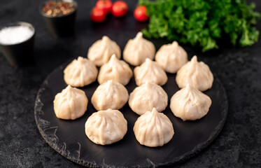 Cooked Khinkali on a stone background