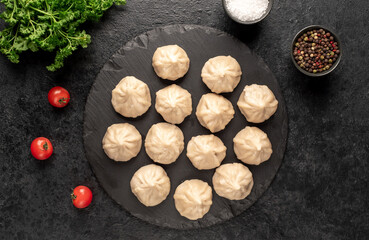 Cooked Khinkali on a stone background