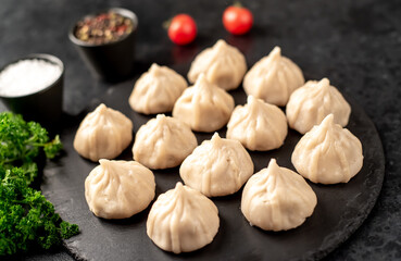 Cooked Khinkali on a stone background