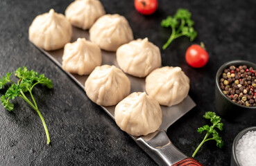 Cooked Khinkali on a stone background