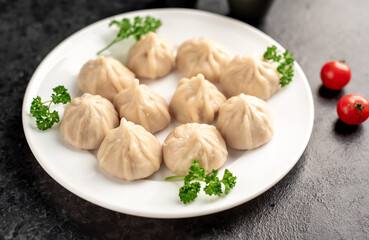 Cooked Khinkali on a stone background