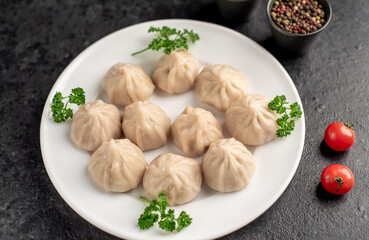 Cooked Khinkali on a stone background