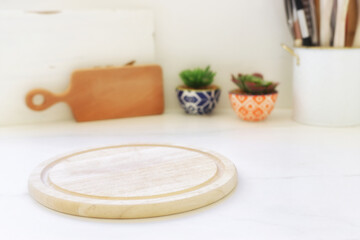 empty table board and defocused modern kitchen background. product display concept