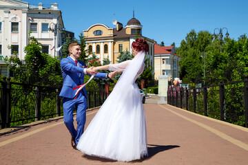 Obraz premium Romantic happy caucasian couple walks on the streets of the city in summer day