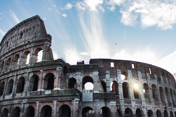 Rome Colosseum with the rising sun inside.