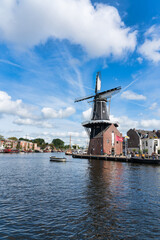 Fototapeta na wymiar Windmill the Adriaan in the historical center of Haarlem city in the Netherlands