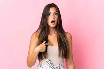 Young brazilian woman isolated on pink background pointing to oneself - obrazy, fototapety, plakaty