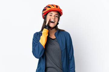 Young cyclist brazilian girl isolated on white  background shouting with mouth wide open