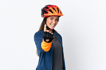 Young cyclist brazilian girl isolated on white  background doing coming gesture