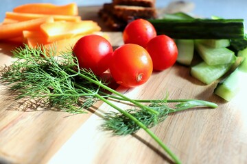 Naklejka na ściany i meble Healthy food. Tomatoes, cucumbers, carrots, dill, danish rye bread. Healthy lifestyle. Organic cooking. Snack vegetables. Food for weight loss.
