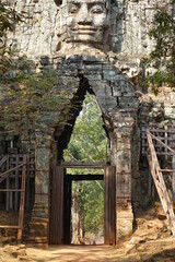 Victory Gate of impressive Khmer temple Angkor Thom (vertical image), Siem Reap, Cambodia