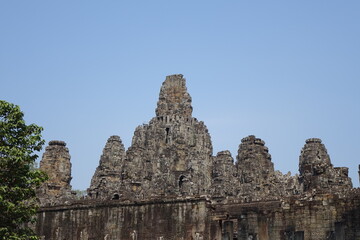 Adventure of exploring mystic Bayon temple in the impressive Khmer ruin city Angkor Thom, Siem Reap, Cambodia