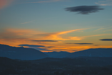 A picturesque landscape view of the French Alps mountains in the Hautes-Alpes department during the sunset