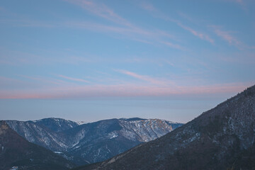 A picturesque landscape view of the French Alps mountains in the Hautes-Alpes department after the sunset