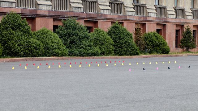 sports plastic cones on an asphalt for skateboarders and roller skaters