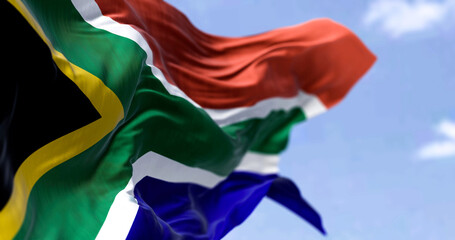 Detailed close up of the national flag of South Africa waving in the wind on a clear day - 480433902