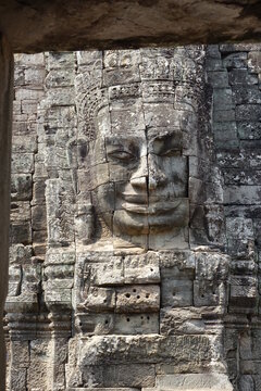 Stone relief in the impressive Khmer ruin city Angkor Thom (vertical image), Siem Reap, Cambodia