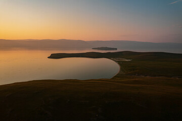 Olkhon Island at sunrise, the largest island in Lake Baikal in eastern Siberia. Shamanka Rock on...