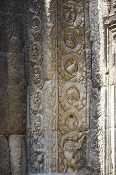 Relief in mystic Ta Prohm temple (vertical image), Siem Reap, Cambodia