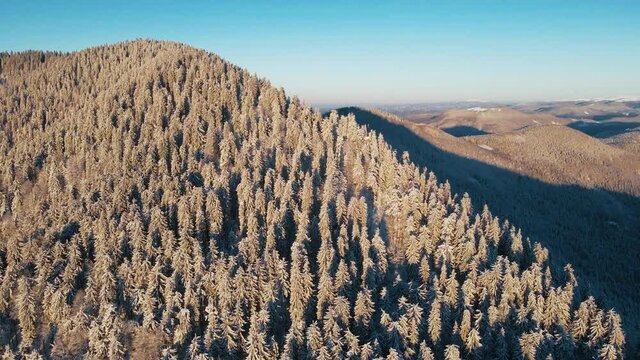 Relaxing flight over the winter mountains