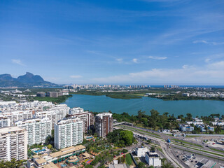 Aerial view of Jacar&eacute;pagua lagoon in Rio de Janeiro, Brazil. Residential buildings and mountains around the lake. Barra da Tijuca beach in the background. Sunny day. Drone photo