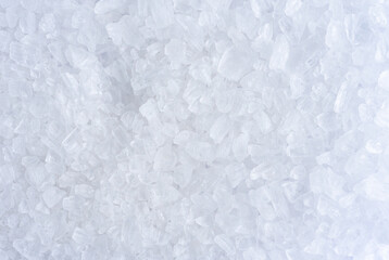 White background of rock salt, macro