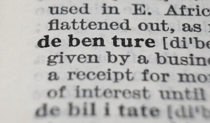 Debenture dictionary definition close-up. Shallow depth of field.