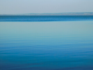 view of beautiful blue lake and forest