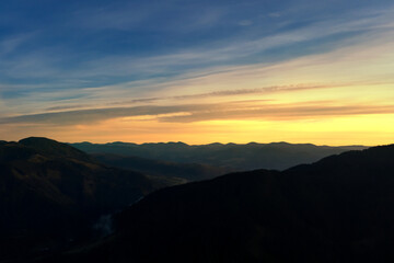 Silhouette of mountain landscape at sunset . Drone photography