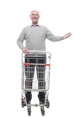 in full growth. a happy man with a shopping cart.