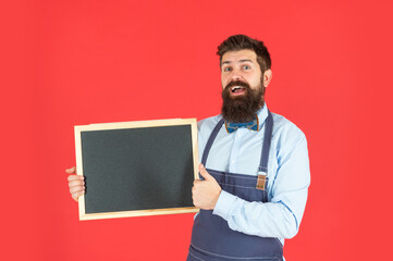 Happy bearded man give thumbs up holding school chalkboard, barber school