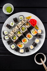 Classic Japanese sushi roll hosomaki with tuna, salmon and shrimp