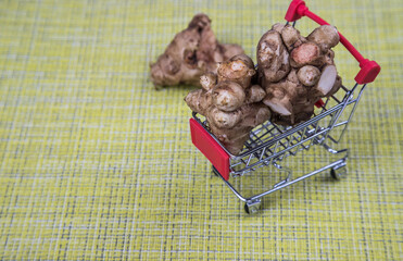 Jerusalem artichoke tuber in a supermarket food cart.