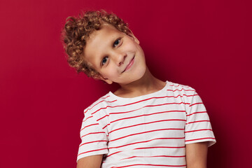 little boy in striped t-shirt gesture hands emotions posing