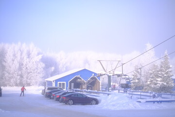 Snow-covered trees in hoarfrost at a ski resort, lift, funicular, ski lift
