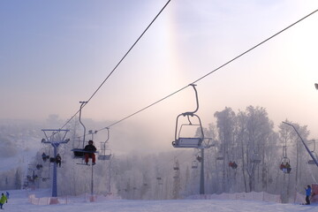 Snow-covered trees in hoarfrost at a ski resort, lift, funicular, ski lift
