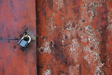 Background of texture grunge metal door in red colors