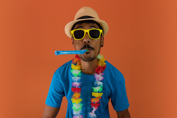Black man in costume for brazil carnival isolated on orange background. African man in various...