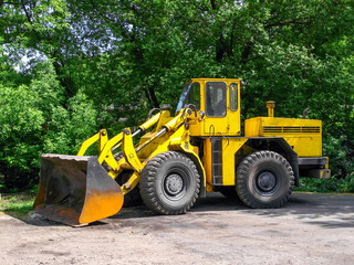 front loader with a large bucket at a ferrous metallurgy plant 