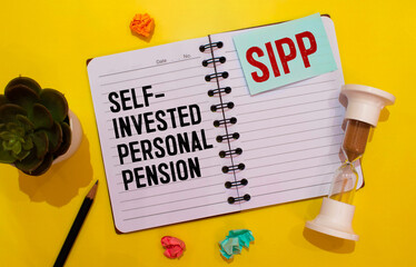 Paper with Self-Invested Personal Pension SIPP on a table