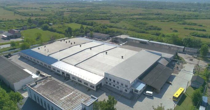 A flight over a new modern furniture factory. Furniture factory top view. Modern factory top view.