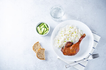 Peking duck with rice on a plate
