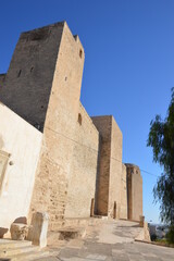 ancient arabic Kasbah fortress in Sousse, Tunisia, Africa. Old walls in sunlight, blue sky, tree and a capitel of an ancient roman column